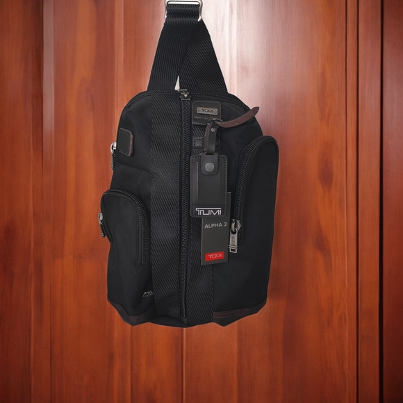 Tumi Black Duffel Bag with Red Accents